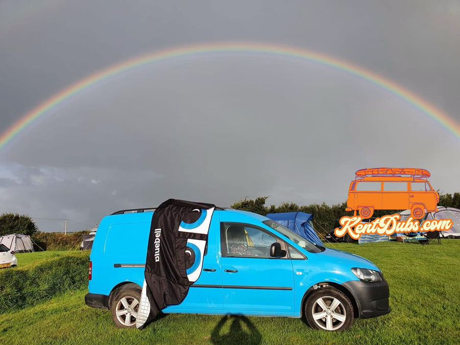 VW Caddy Mk3 under a rainbow
